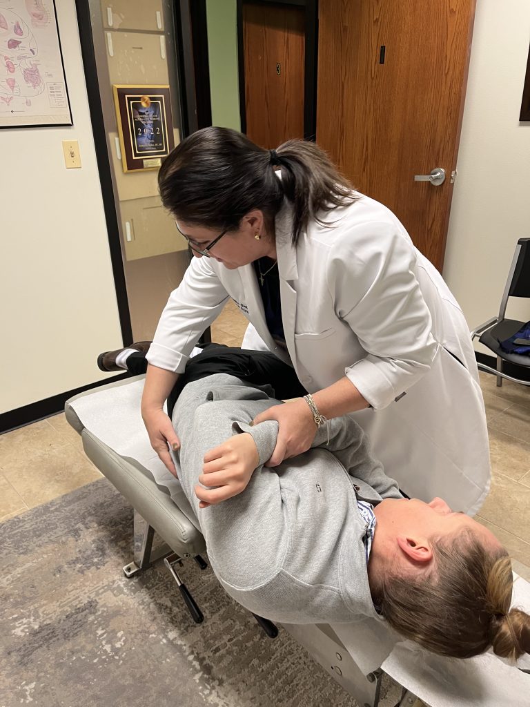 Dr. Angie Skokos performing a gentle neck adjustment