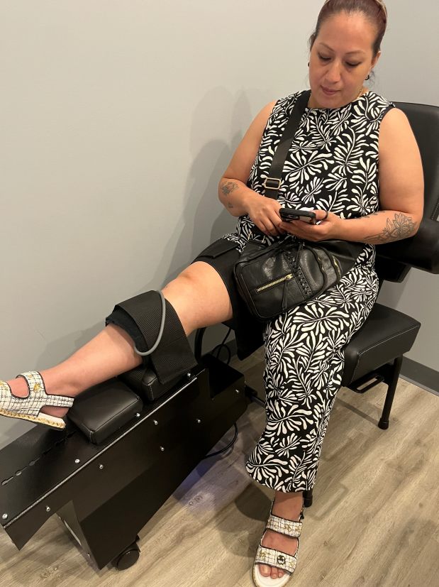 Patient receiving knee traction treatment at Chiro Care Wellness Clinic in Westmont